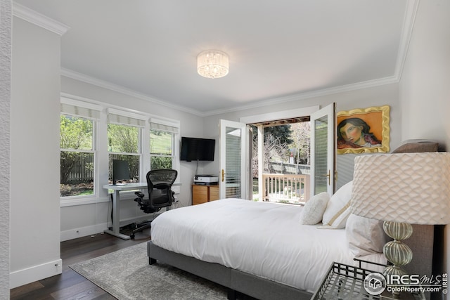 bedroom with baseboards, dark wood finished floors, and ornamental molding