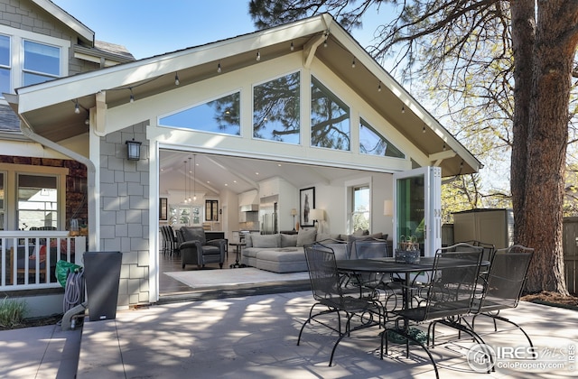 view of patio with outdoor lounge area and outdoor dining space