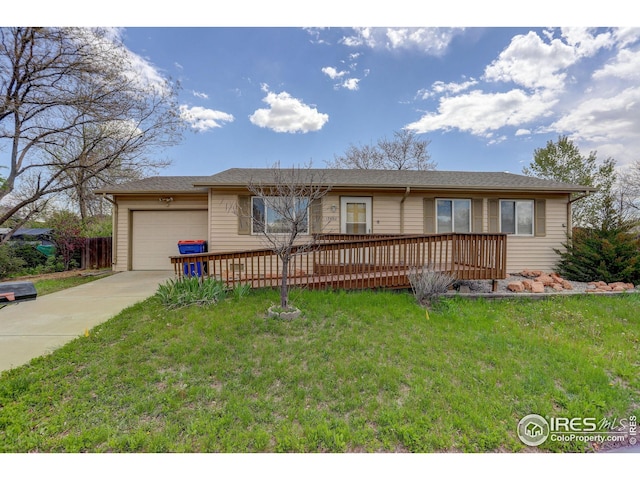 ranch-style home featuring driveway, a front lawn, and a garage