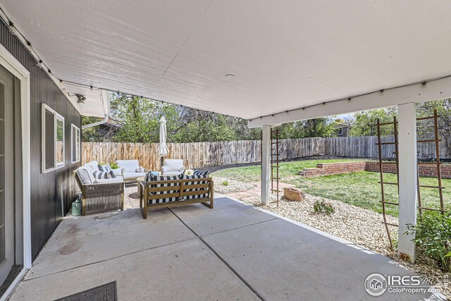 view of patio / terrace featuring a fenced backyard and an outdoor hangout area
