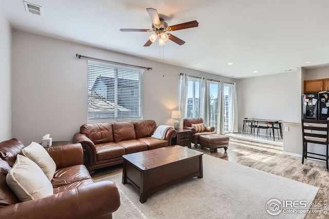 357 Chipman Dr, Windsor, CO 80550 - living room with recessed lighting, ceiling fan, light wood-type flooring, and visible vents