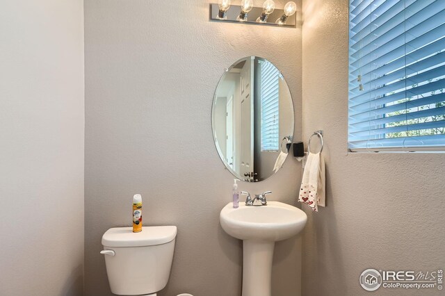 357 Chipman Dr, Windsor, CO 80550 - half bath with a sink and toilet