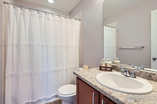 357 Chipman Dr, Windsor, CO 80550 - full bath featuring toilet, a shower with shower curtain, and vanity