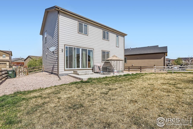 357 Chipman Dr, Windsor, CO 80550 - back of house featuring a fenced backyard, a patio area, a yard, and entry steps
