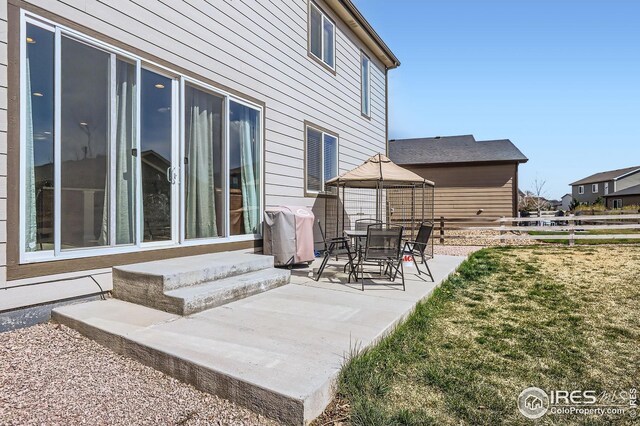 357 Chipman Dr, Windsor, CO 80550 - view of patio / terrace with fence and entry steps