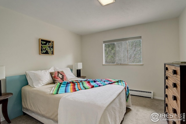 carpeted bedroom with baseboards and a baseboard heating unit