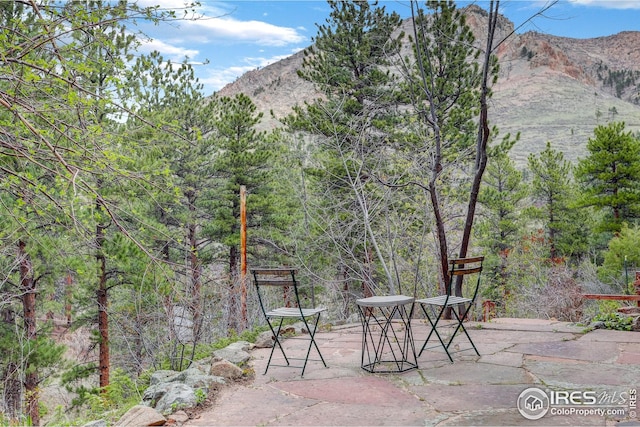 view of patio / terrace with a mountain view