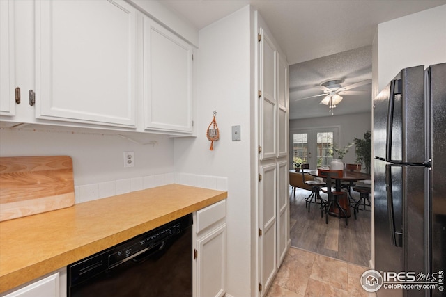 kitchen featuring light countertops, a ceiling fan, black appliances, and white cabinetry
