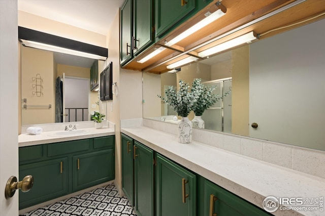 full bath with vanity and a shower stall