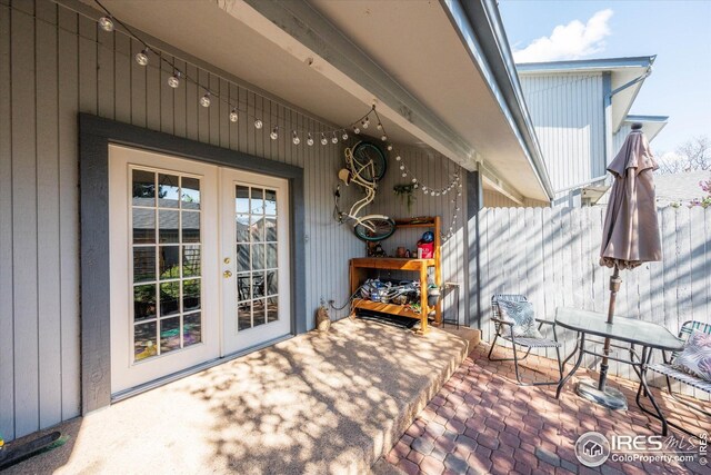 view of patio / terrace with french doors and fence