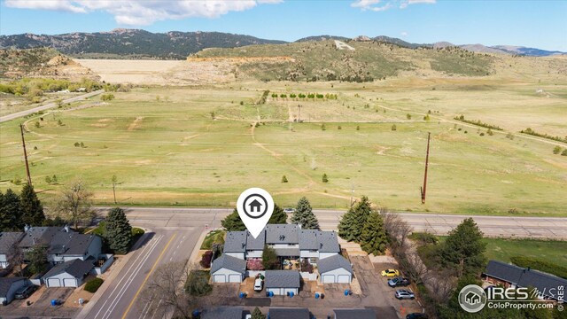drone / aerial view featuring a mountain view and a rural view
