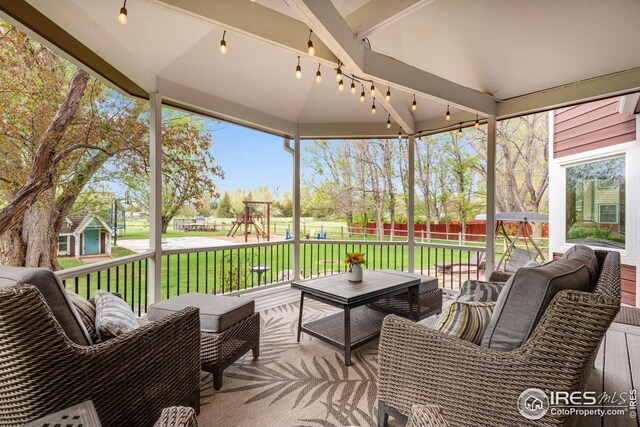 7628 Estate Cir, Niwot, CO 80503 - sunroom with outdoor lounge area and beam ceiling