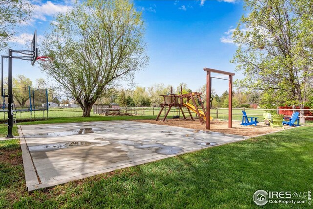 7628 Estate Cir, Niwot, CO 80503 - communal playground featuring a yard, fence, and a trampoline