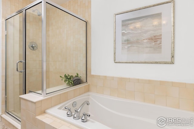 2001 Lincoln St Unit 2113, Denver, CO 80202 - full bath with a shower stall and a garden tub