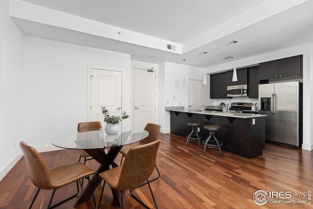 2001 Lincoln St Unit 2113, Denver, CO 80202 - dining space with dark wood finished floors and baseboards