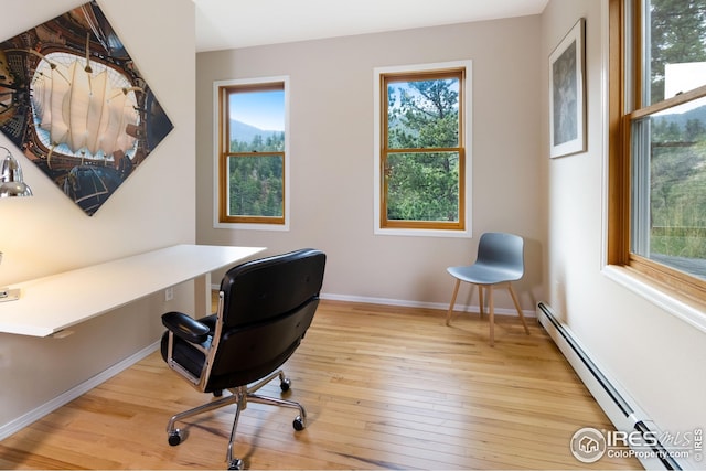 18 Pine St, Jamestown, CO 80455 - office area with baseboard heating, hardwood / wood-style floors, baseboards, and plenty of natural light