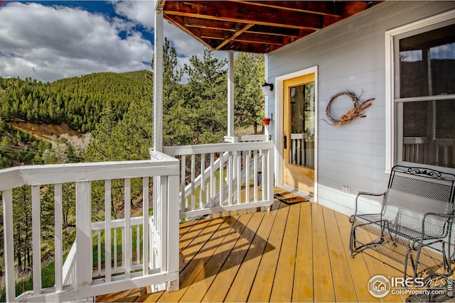 18 Pine St, Jamestown, CO 80455 - wooden terrace featuring a view of trees