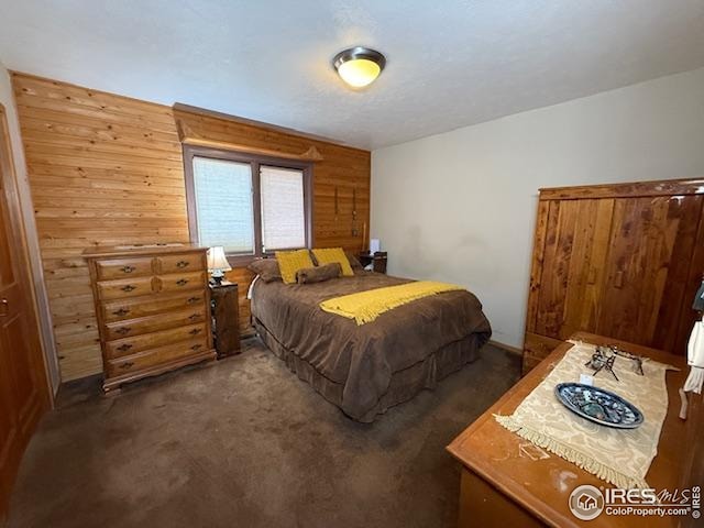 7127 Coal Creek Canyon Hwy, Nederland, CO 80466 - bedroom with carpet and wooden walls