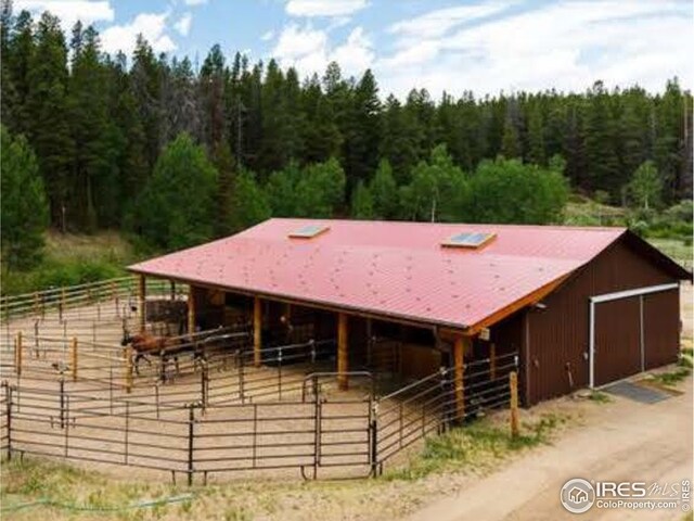 7127 Coal Creek Canyon Hwy, Nederland, CO 80466 - stable featuring a forest view