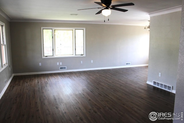 817 Warner St, Fort Morgan, CO 80701 - spare room with crown molding, dark wood-style flooring, ceiling fan with notable chandelier, and visible vents
