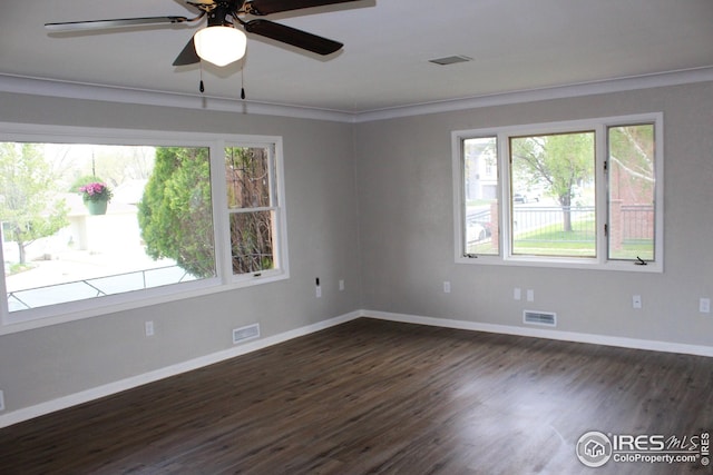 817 Warner St, Fort Morgan, CO 80701 - empty room with baseboards, dark wood finished floors, and visible vents