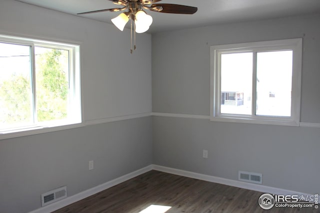 817 Warner St, Fort Morgan, CO 80701 - empty room with baseboards, ceiling fan, visible vents, and dark wood-style floors