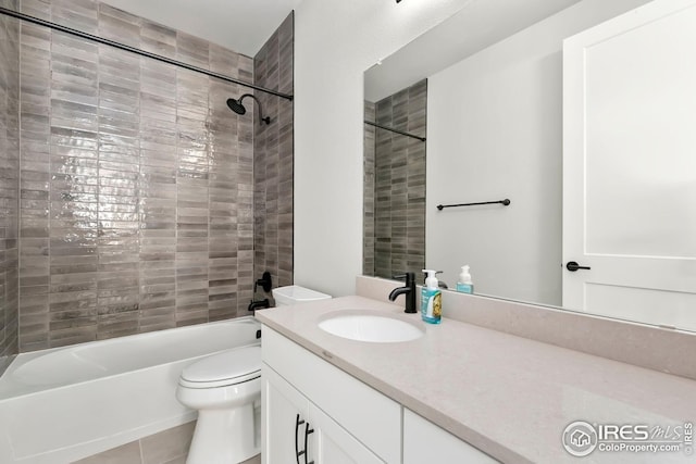 full bathroom featuring toilet, bathing tub / shower combination, tile patterned flooring, and vanity