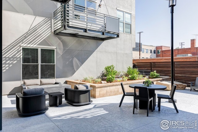 1707 Walnut St Unit 210, Boulder, CO 80302 - view of patio featuring outdoor dining area and a balcony