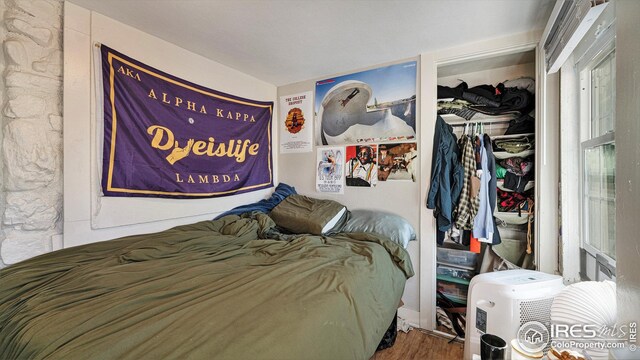 bedroom featuring wood finished floors