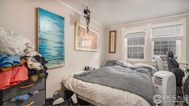 bedroom featuring crown molding