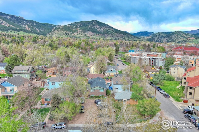 aerial view of residential area featuring a mountain backdrop