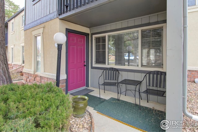 750 W Moorhead Cir Unit A, Boulder, CO 80305 - view of exterior entry with covered porch and a balcony