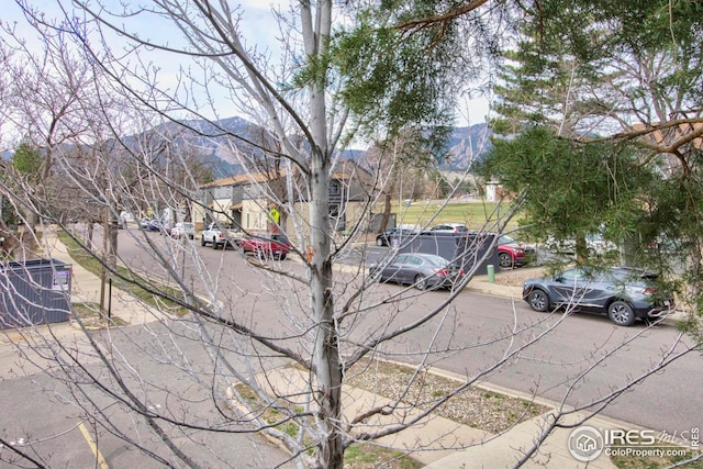 750 W Moorhead Cir Unit A, Boulder, CO 80305 - view of asphalt street with a mountain view, sidewalks, and curbs