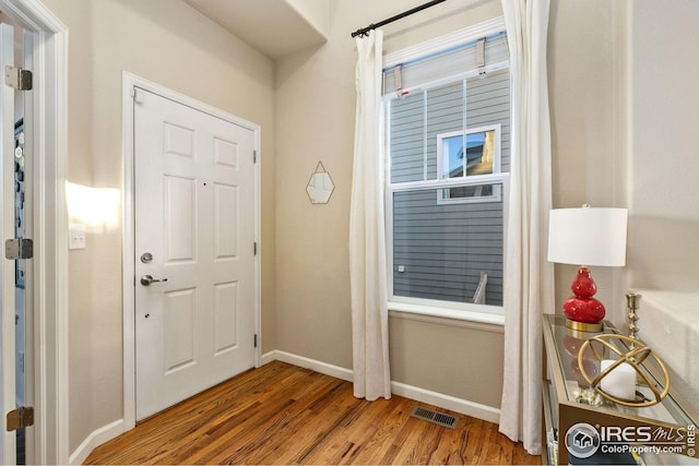5433 Wishing Well Dr, Timnath, CO 80547 - entryway with wood finished floors and baseboards