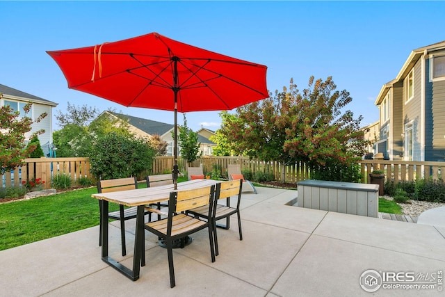 5433 Wishing Well Dr, Timnath, CO 80547 - view of patio featuring a hot tub, outdoor dining area, and a fenced backyard
