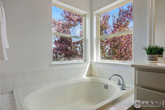4856 10th St, Boulder, CO 80304 - full bath with a textured wall and a bath