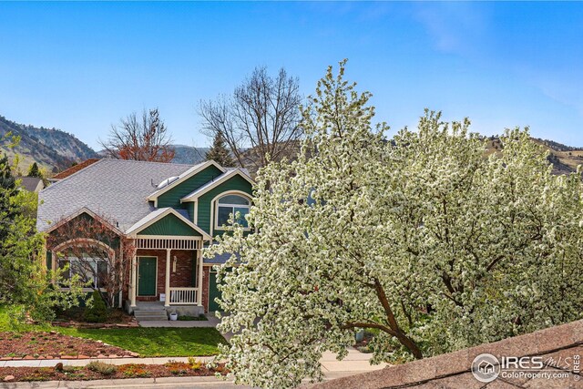 4856 10th St, Boulder, CO 80304 - view of front facade with brick siding and a mountain view