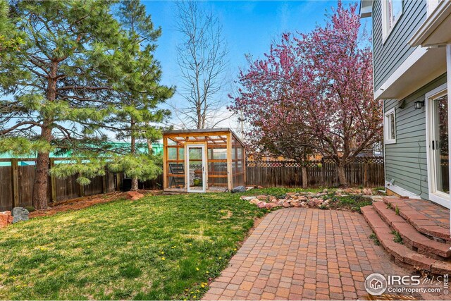 4856 10th St, Boulder, CO 80304 - view of yard featuring an exterior structure, an outdoor structure, and a patio