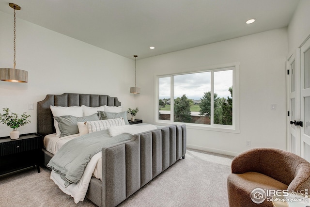 bedroom featuring light colored carpet, recessed lighting, and baseboards