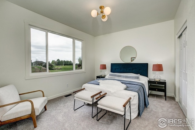 bedroom featuring carpet flooring, baseboards, and a closet