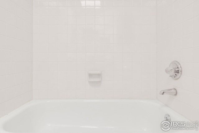 bathroom with a tub