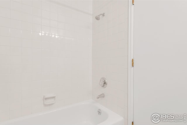 bathroom with shower / washtub combination