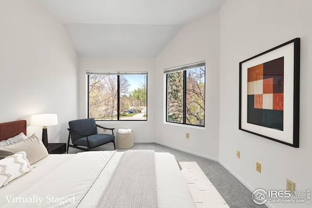 bedroom with vaulted ceiling, carpet, multiple windows, and baseboards
