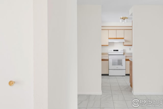kitchen featuring white range with electric cooktop, under cabinet range hood, baseboards, light countertops, and light marble finish flooring