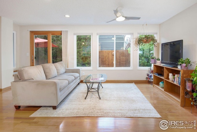 3821 Howe Ct, Boulder, CO 80301 - living room with healthy amount of natural light, wood finished floors, ceiling fan, and recessed lighting