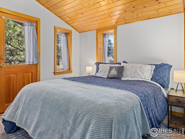bedroom featuring vaulted ceiling and wood ceiling
