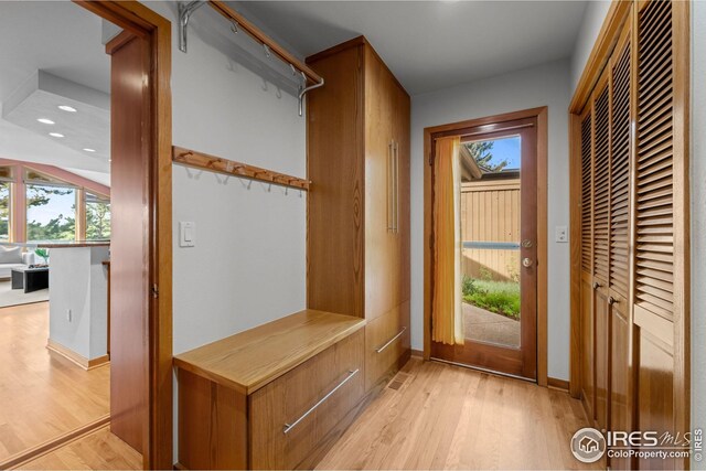 560 Northstar Ct, Boulder, CO 80304 - unfurnished office featuring rail lighting, lofted ceiling, light wood-type flooring, and baseboards