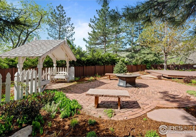 560 Northstar Ct, Boulder, CO 80304 - view from above of property with a mountain backdrop and a heavily wooded area