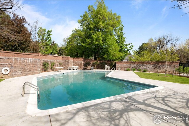 560 Northstar Ct, Boulder, CO 80304 - view of swimming pool featuring a patio area and a fenced backyard