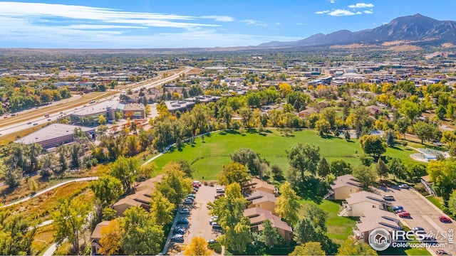 aerial overview of property's location with a mountain backdrop and nearby suburban area